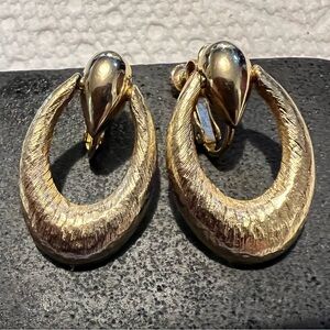 Vintage Napier gold tone textured clip on door knocker earrings.